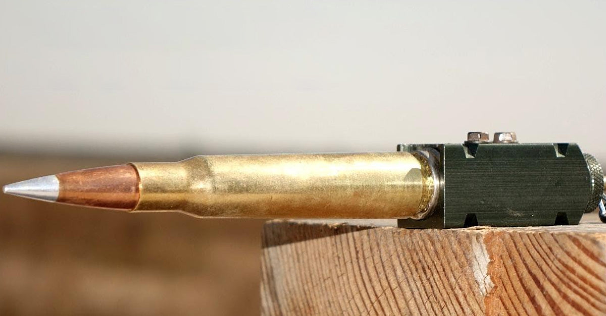 50 cal BMG fired outside of a rifle with shotgun shell tripwire