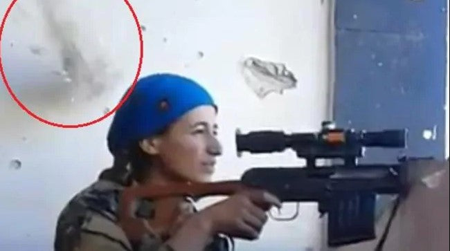 Female Kurdish sniper bullet narrowly misses her head