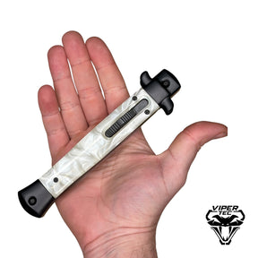 white pearlex handle Italian stiletto OTF automatic knife closed view